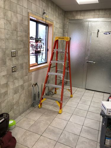 Tile walls and floors for commercial kitchen. 